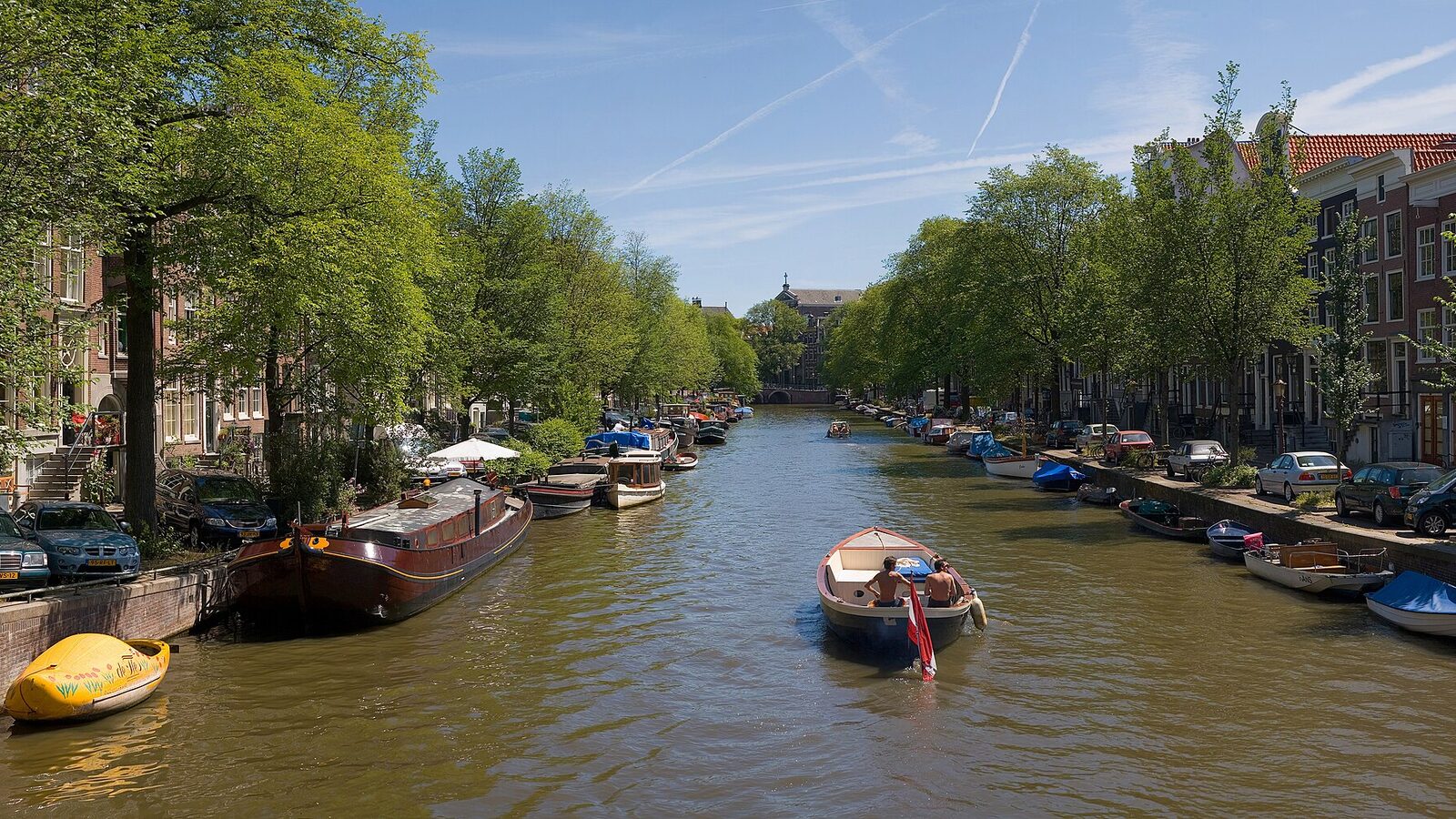 A panorama of 4 segments of an Amsterdam Canal in summer