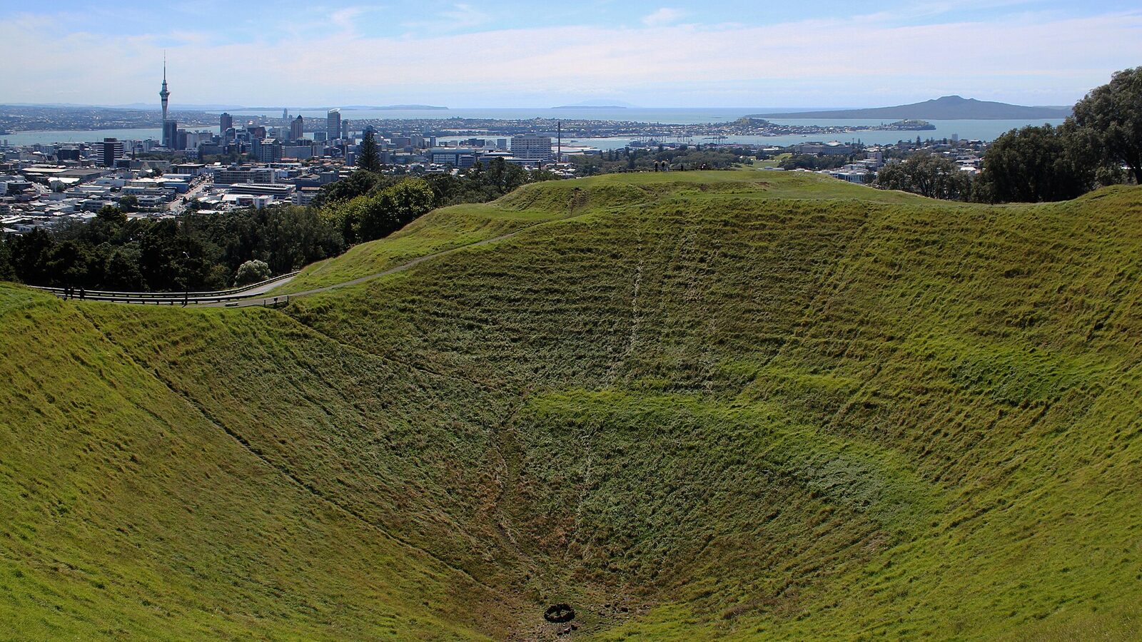 Mount Eden crater with Auckland CBD and Rangitoto skyline