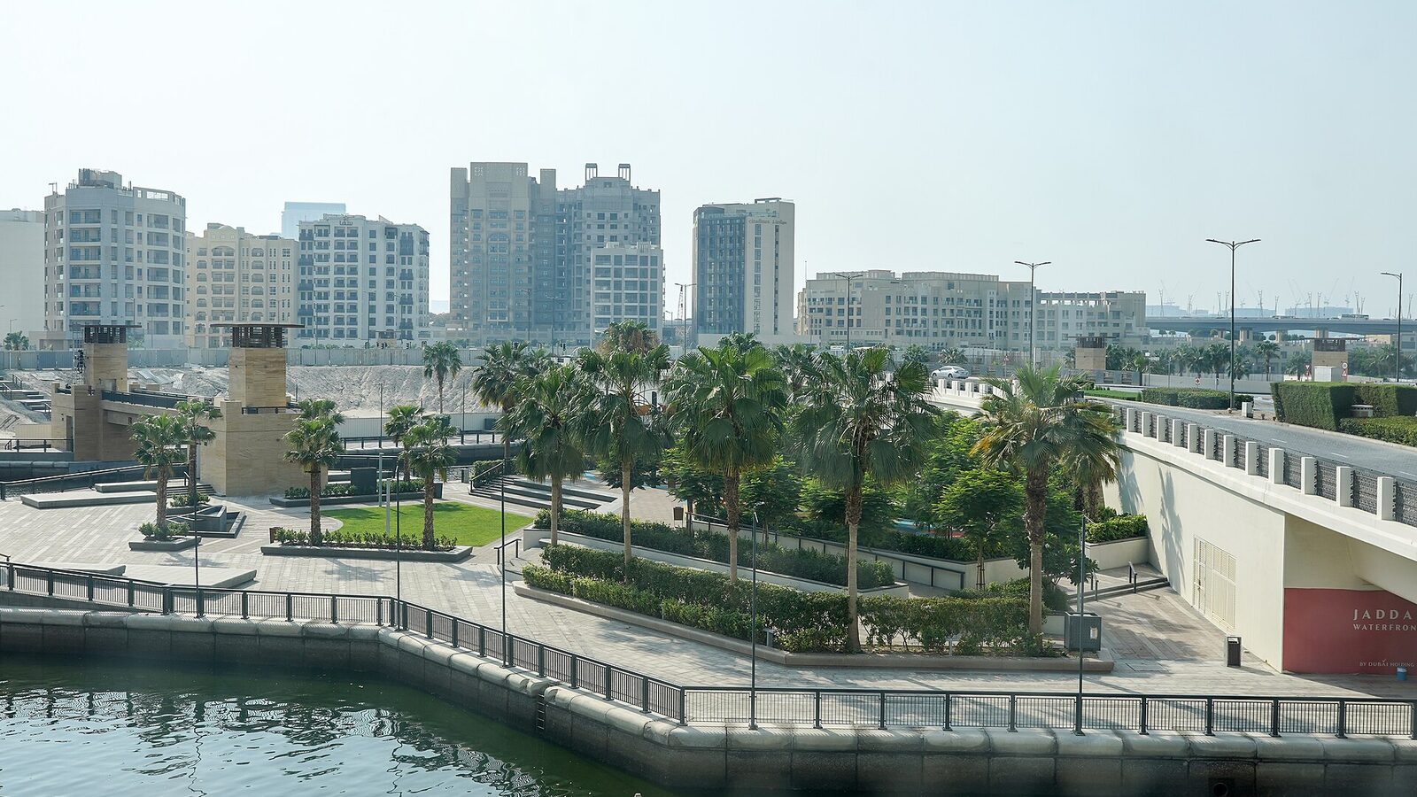 View from Ink Hotel: Exercise park in the coconut grove. Inlet of Dubai Creek, skyline of Jaddaf Waterfront, Dubai, UAE