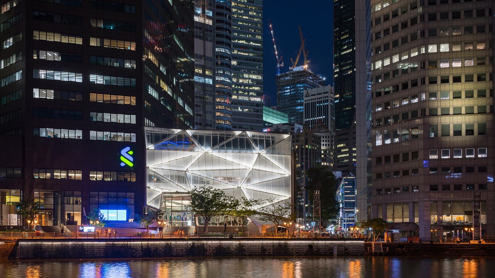 Downtown Core in Singapore as seen across the Singapore River at night on August 18, 2023
