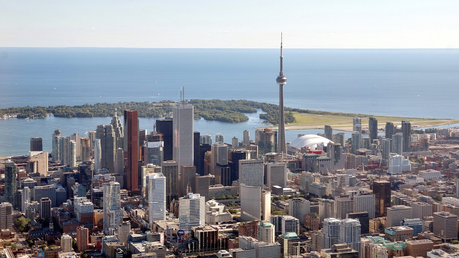 Aerial view of downtown Toronto (from helicopter), with view of Toronto Islands and Lake Ontario in the background