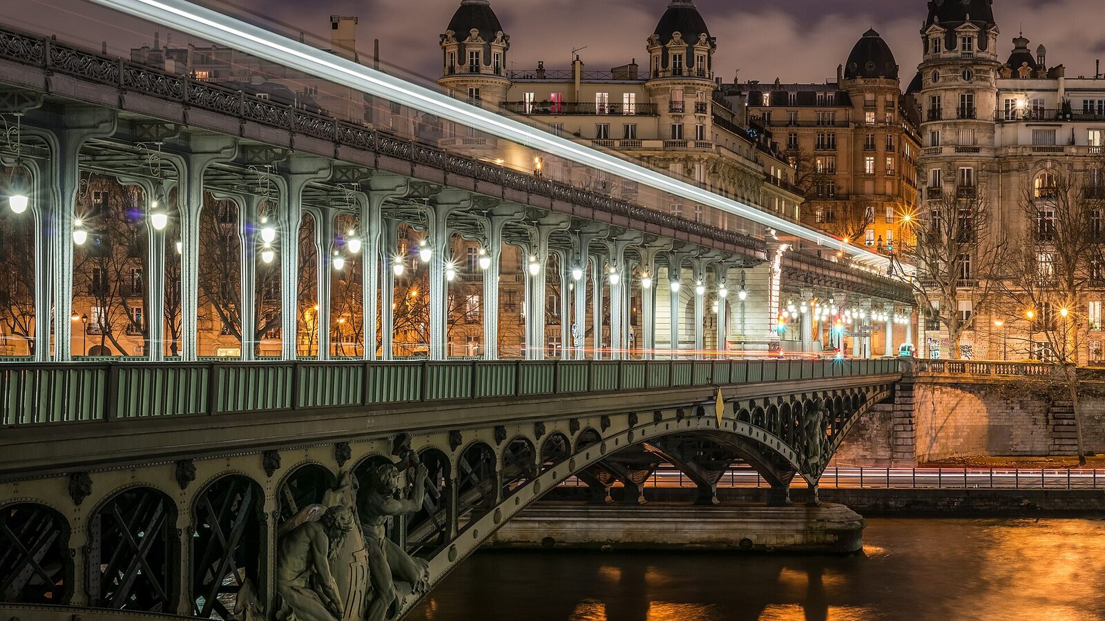 The western part of the Pont de Bir-Hakeim seen at night. Buildings of the 16th arrondissement of Paris are visible in the background