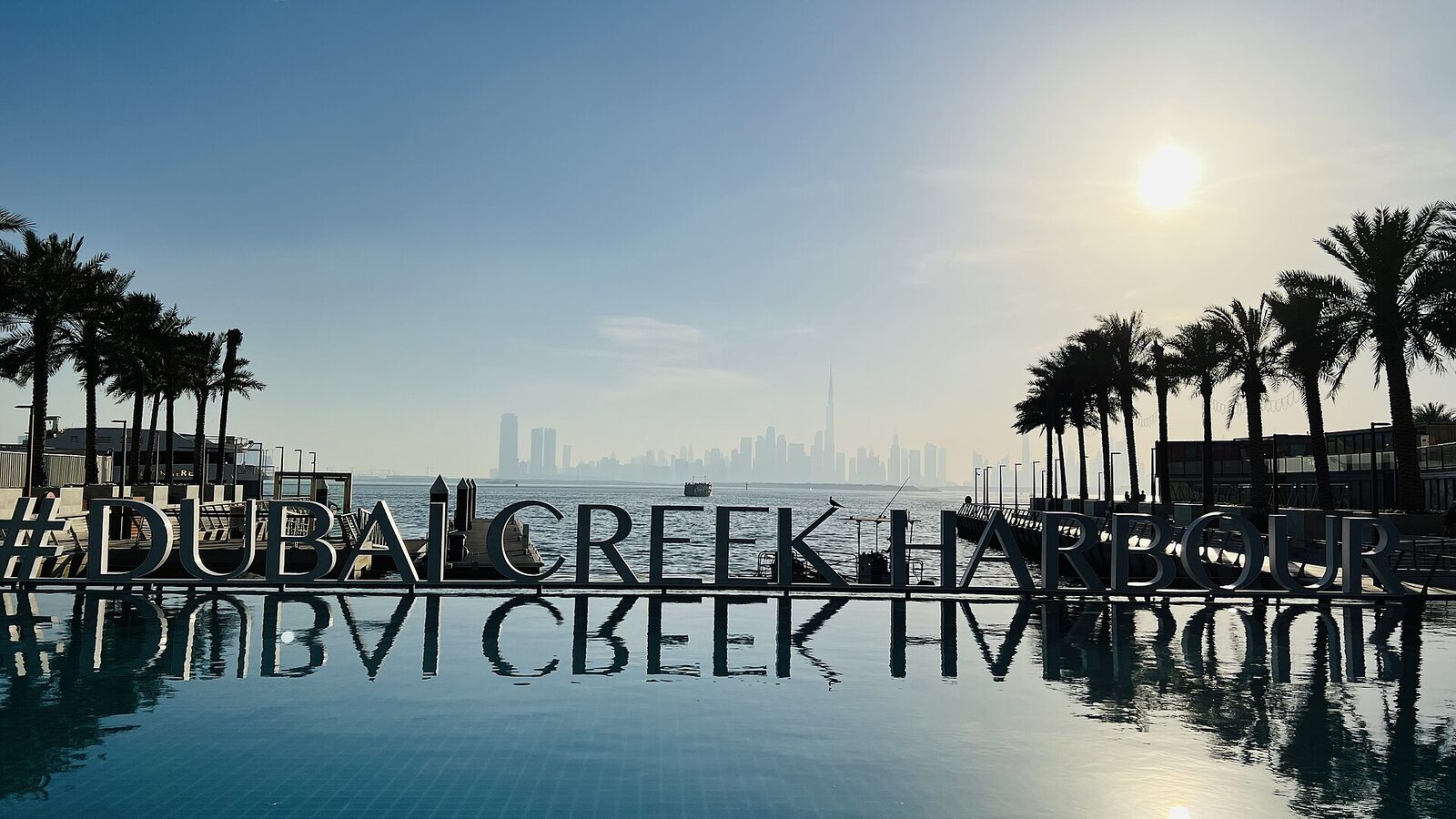 Sign at Dubai Creek Harbour, Dubai, UAE, with the Burj Khalifa in the distance. Photography Point in Dubai Creek Harbour