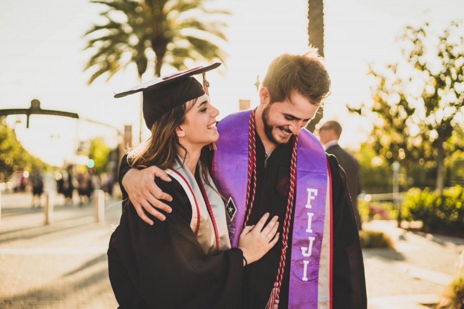Graduates on campus after the ceremony