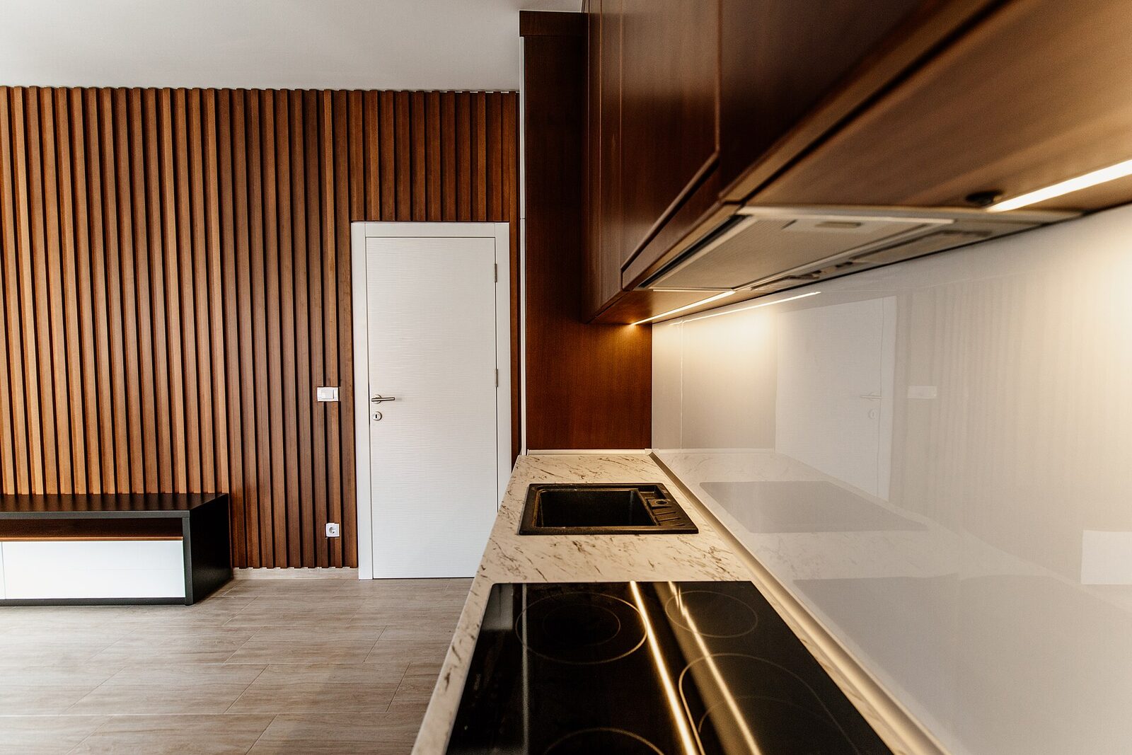 Open-plan living room with walnut kitchen
