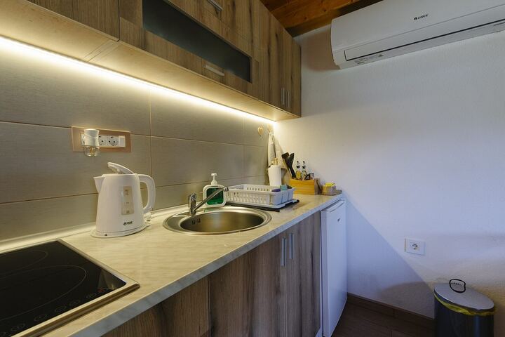 Compact kitchenette with hob and sink
